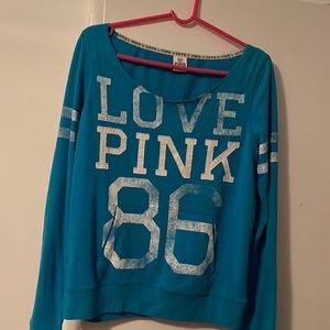 pink long sleeve sweatshirt with “86”